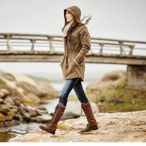woman in ariat country boots walking outside